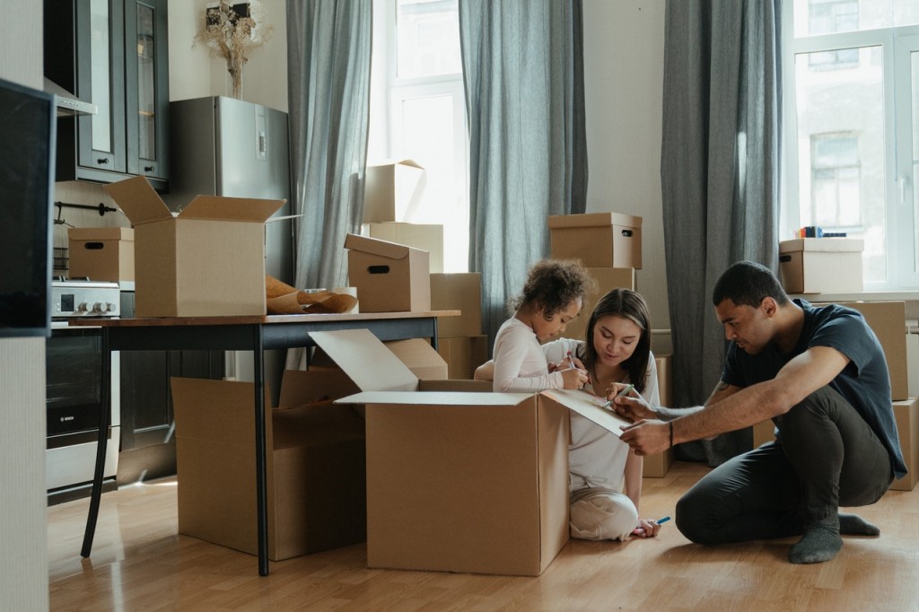 a family with moving boxes