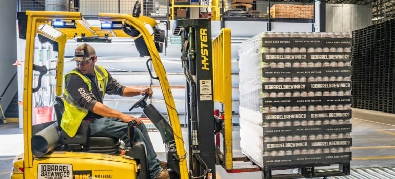 man using a forklift