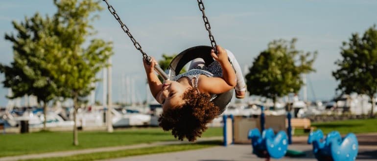 A toddler on a swing