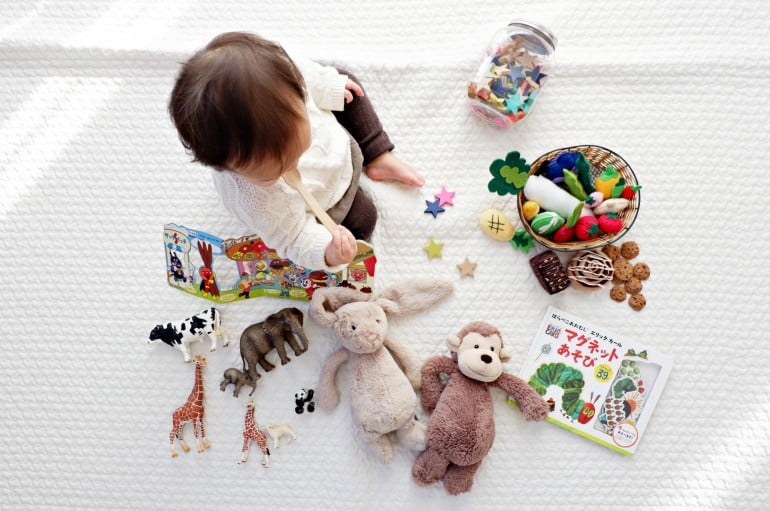 kid playing with toys