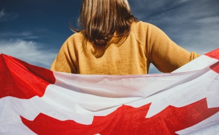 girl holding Canadian flag