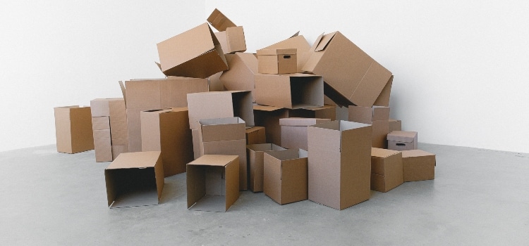a pile of moving boxes on the floor