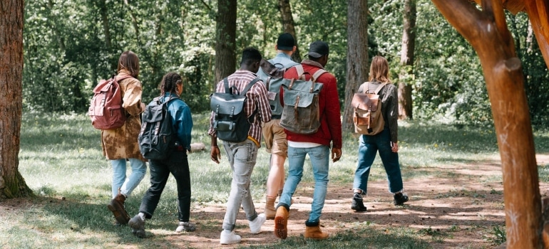 a group of people hiking through the woods