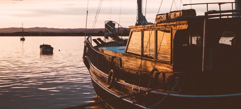 a fishing boat captured during the golden hour at sea