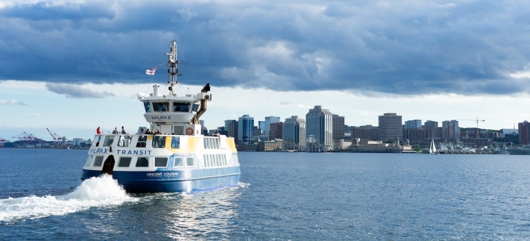 a ferry going towards the city of Halifax, one of the best Canadian cities for expats