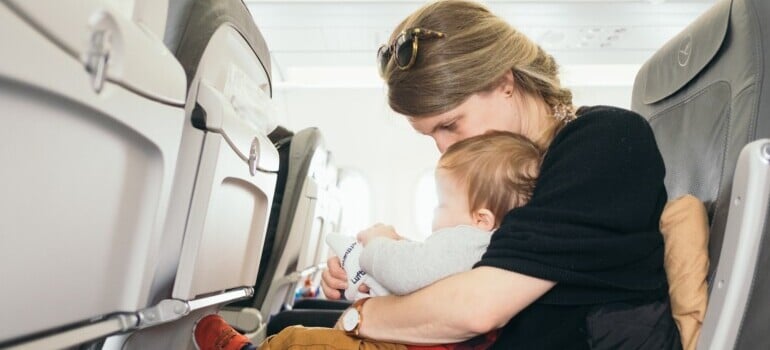 Woman Moving cross Canada with kids in the plane