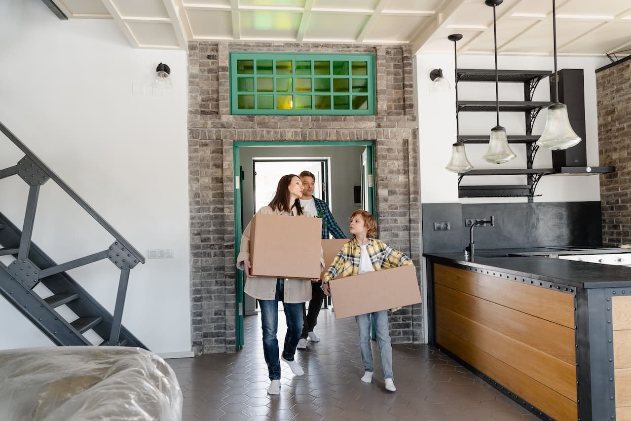 Family with their child moving into a industrial home