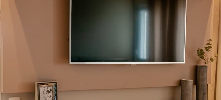 flat screen TV on a room wall 