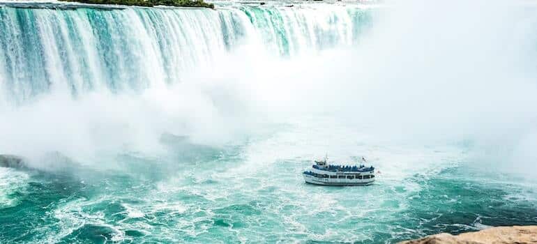 A boat besides the Niagara Falls
