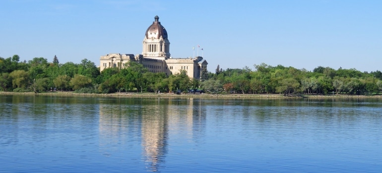 road trips for exploring Canada's provinces might lead you to see Canada's Legislative building across the river
