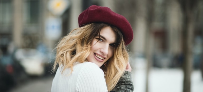 smiling young woman with burgundy beret