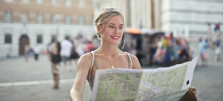 a woman reading about the Things to see and do during your first month of living in Ottawa