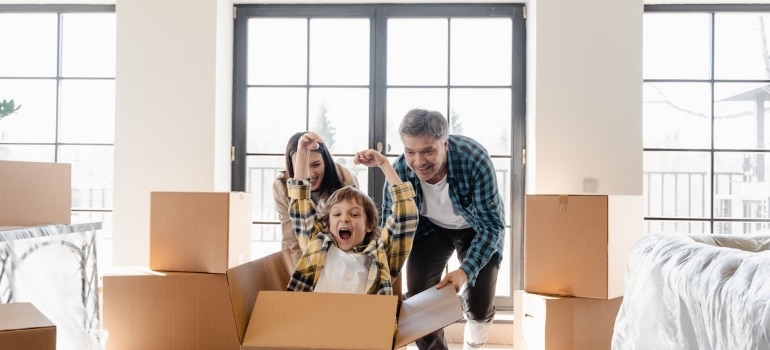 Picture of a family moving into a new home