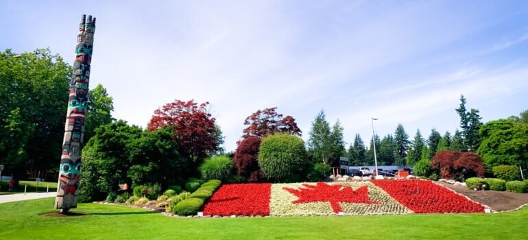 Trees and flowers forming a Canadian flag that you see after moving from Calgary to Surrey