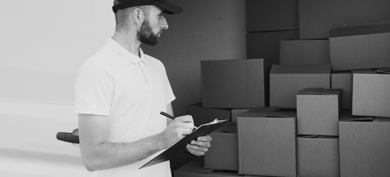 Picture of a person looking at boxes 