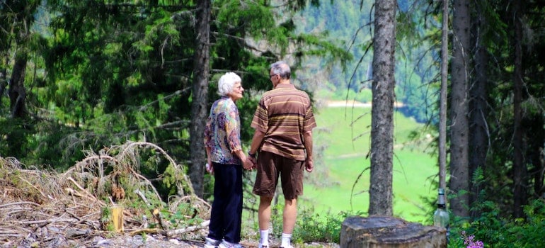 senior couple taking a walk in the woods