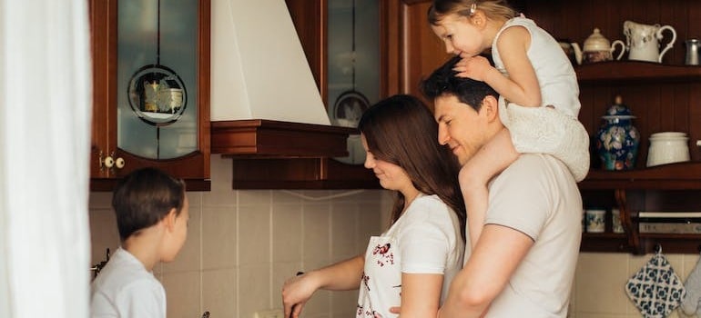 A family inside a kitchen