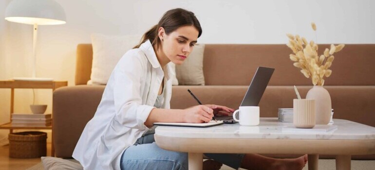 Woman researching and taking notes regarding why your Canadian home isn't selling