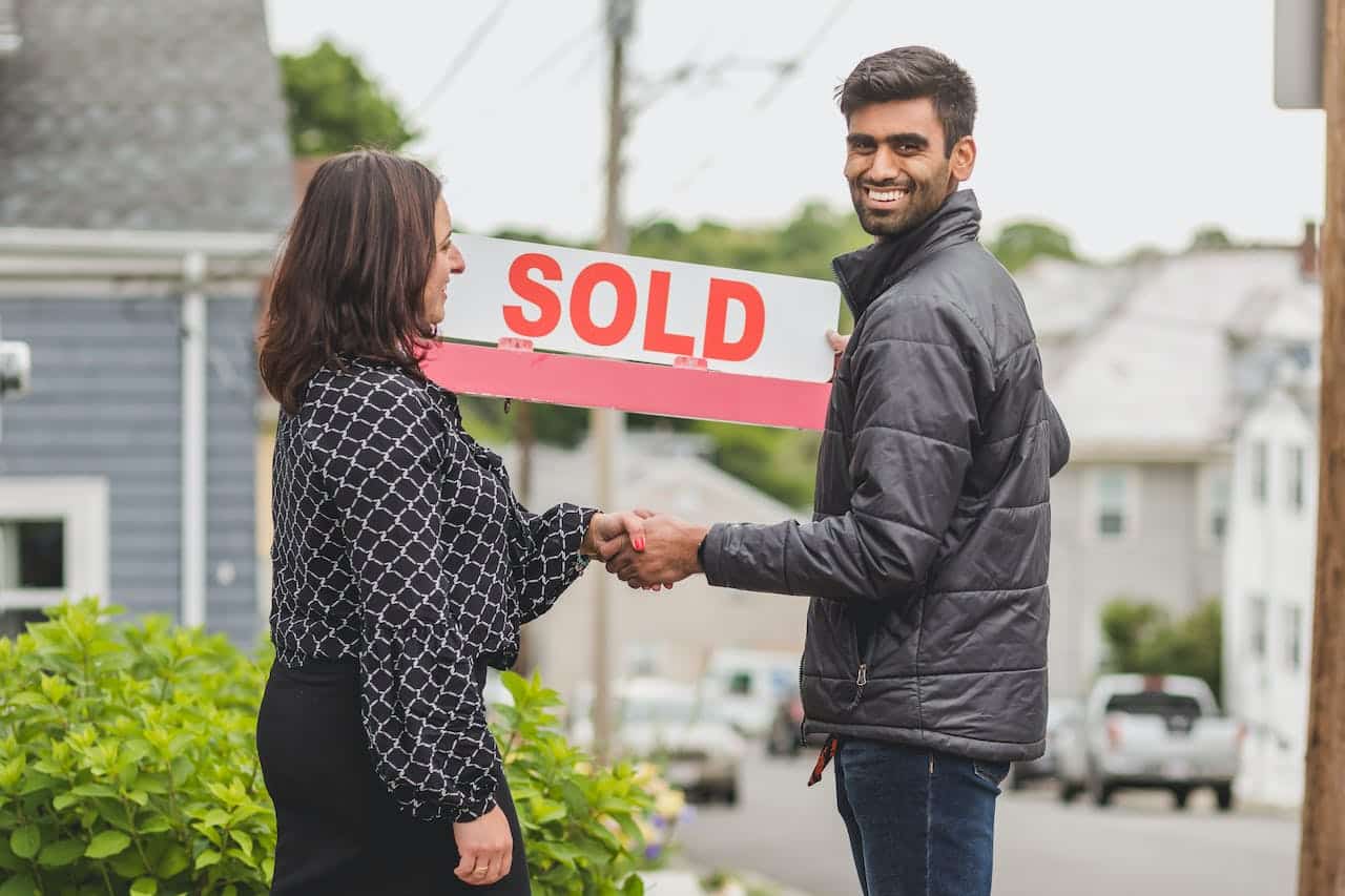 A real estate agent selling a home to a first-time home buyers in Halifax NS