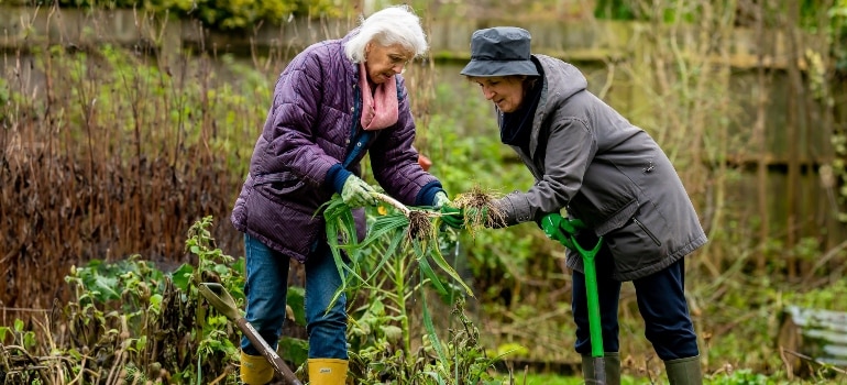 Two women gardening at one of the best places to retire in British Columbia