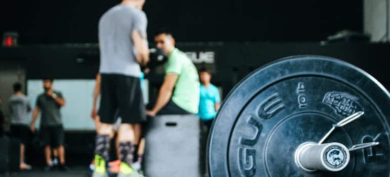 weights and people in the background