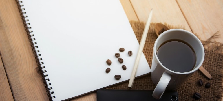 A piece of paper with coffee next to it.