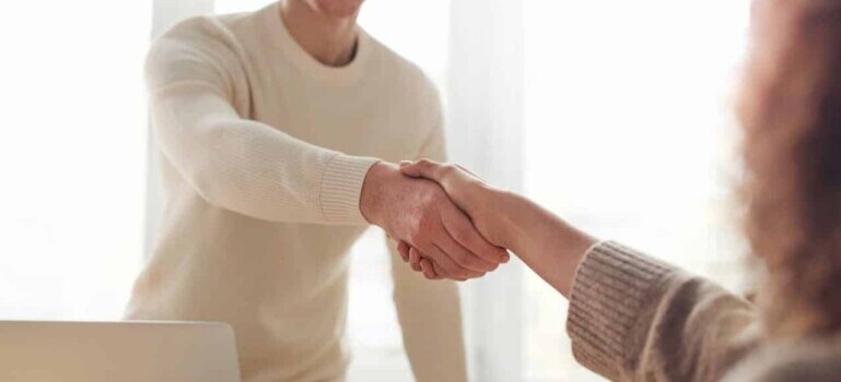 two people shaking hands