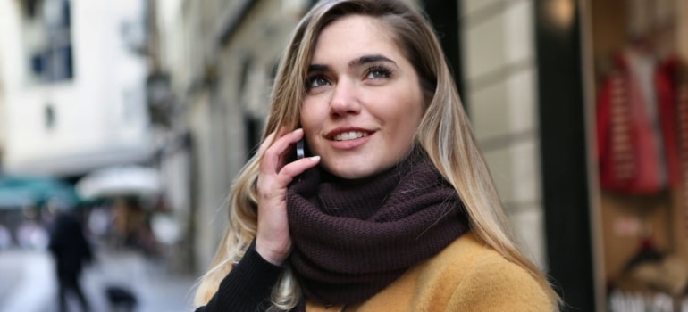 Person smiling while on a phone call