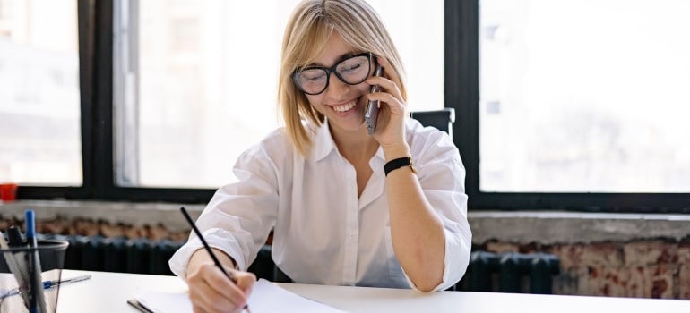Person smilling while on the phone