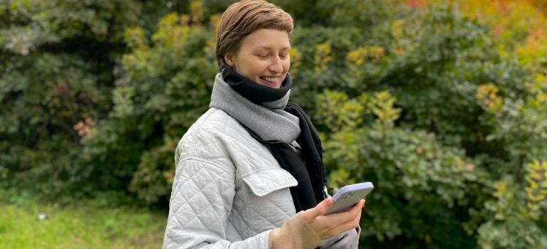 Person who is happy because she managed to contact some of the best Ontario to New Brunswick movers