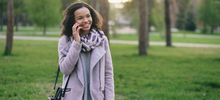 Person smiling during a phone call